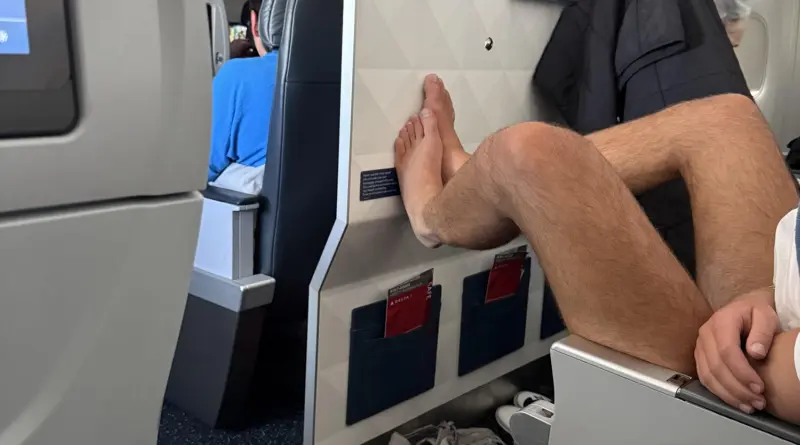 No Pants, No Socks: Delta Passenger Lets It All Hang Out, Feet On Bulkhead Wall - View from the Wing