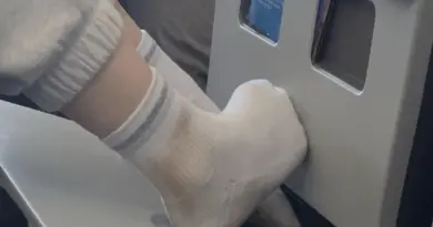 Would You Eat Here? American Airlines Passenger Plants Dirty Socks On Tray Table While Crew Looks Away - View from the Wing